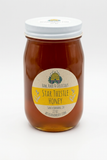 Star Thistle Honey glass jar on a white background